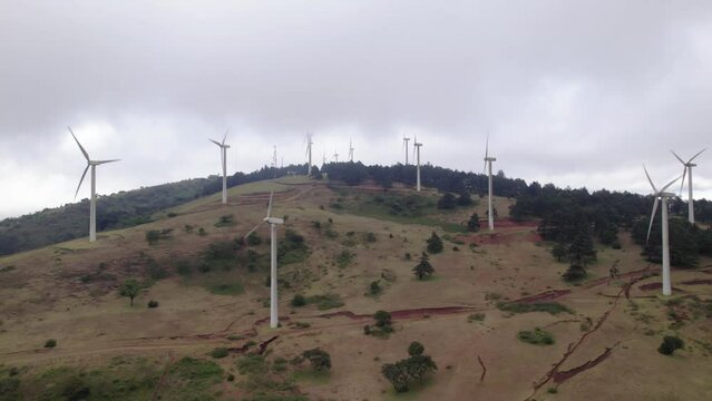 Aerial drone shot of Ngong hills Kenya windmills spinning
