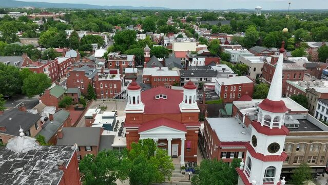 Rising aerial of colonial downtown historic district in Frederick Maryland.