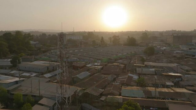 Low flying drone shot of Kibera, Nairobi with the sunset.