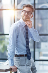 Young businessman working at office