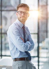 Young businessman working at modern glass office