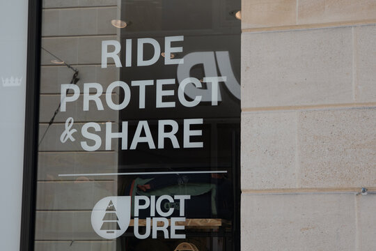 picture ride protect share logo text and brand sign on entrance fashionable store facade in the city center street