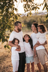 happy large family outside the city in nature