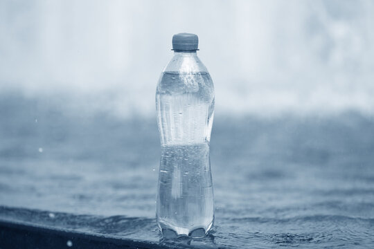 bottle of water near fountain