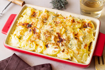 Potato casserole with cheese and cream. Vegetarian food. French food. Gratin dauphinois.
