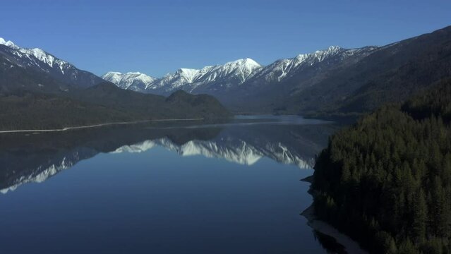 Smoke-Kissed Reflections: Enchanting Beauty of Slocan Lake's Misty Tranquility