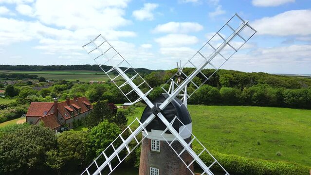 Close up aerial view of a windmill situated in the English countryside. Weybourne, Norfolk, UK.