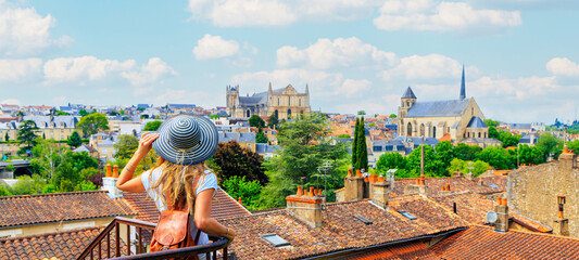 Poitiers city landscape- Woman looking at urban skyline- France - obrazy, fototapety, plakaty