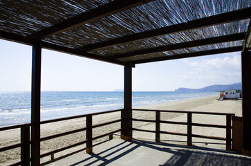 Wooden veranda and shadow on a Mediterranean beach