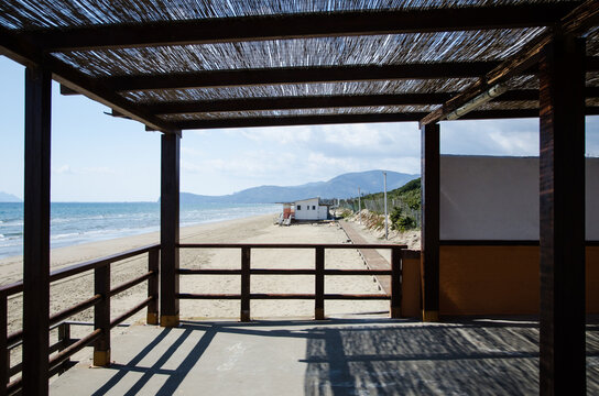 Wooden veranda and shadow on a Mediterranean beach