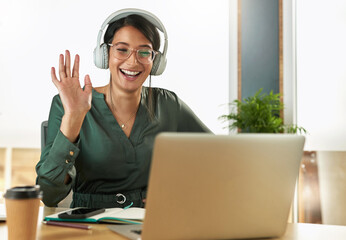 Virtual meeting, business woman and happy wave on a video call with headphones and greeting. Laptop, working and female employee with company webinar and computer with digital communication at office