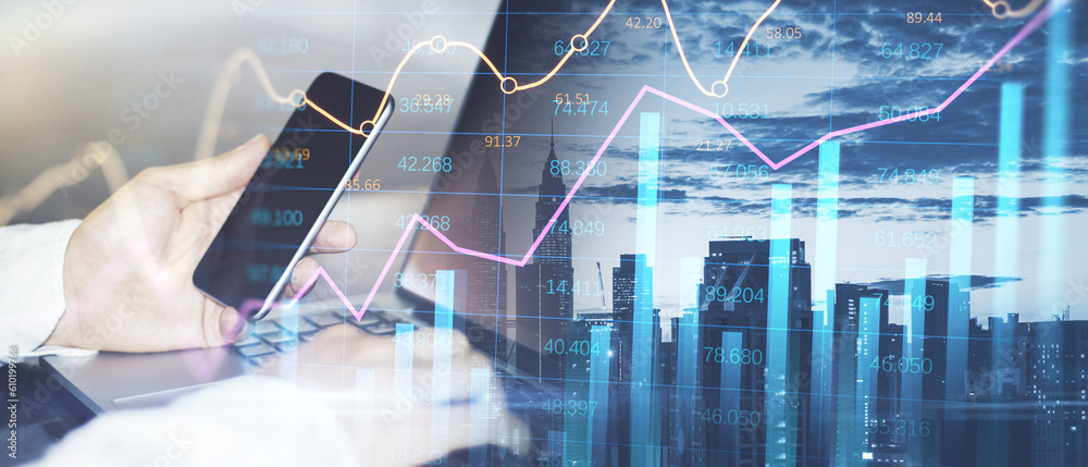 Poster close up of male hands using laptop and smartphone on abstract wide city background with forex chart