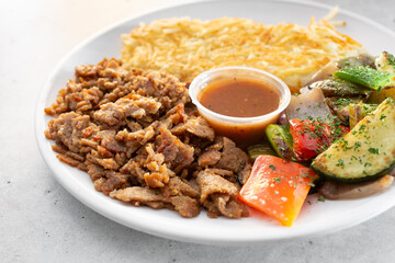 A view of a plate of chopped vegan shawarma.