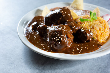 A view of a plate of chicken mole.