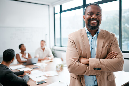 Business, black man and smile in portrait with arms crossed, leadership and meeting with group for corporate project. Team leader, management and confidence with male person in conference room