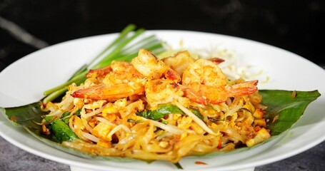 Thailand national dishes, Shrimps Pad Thai. Street food in Thailand. Thai fried noodles Pad Thai with shrimp and vegetables. Thai cuisine delicious