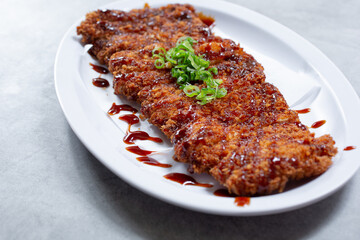 A view of a plate of chicken katsu.