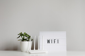 wifi connection concept - white router on table with copy space