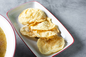 A view of a side dish of Indonesian garlic tapioca crackers.