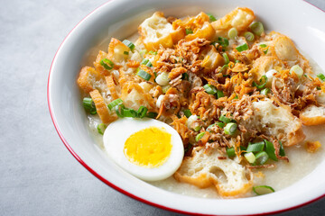 A closeup view of a bowl of bubur ayam.