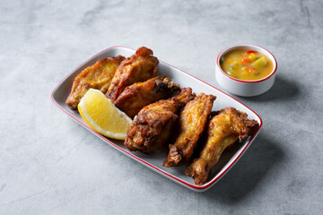 A view of a plate of ayam goreng kuning.