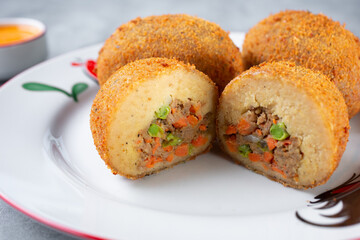 A view of a beef croquette.