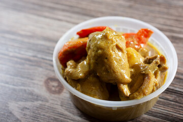 A view of a bowl of Filipino style chicken curry.