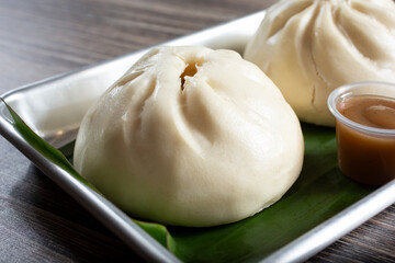 A closeup view of a tray of siopao.