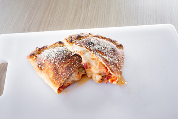A view of a sliced open calzone.