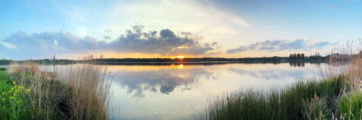 Fototapeta na wymiar Lake De Poel in the Bos in Amstelveen near Amsterdam at sunset
