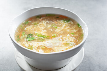 A view of a bowl of egg drop soup.