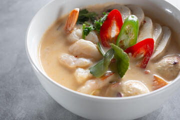 A view of a bowl of tom kha shrimp.