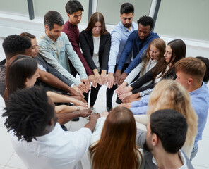 Narrow banner of multiracial people stack hands motivated for shared business success or goal achievement.