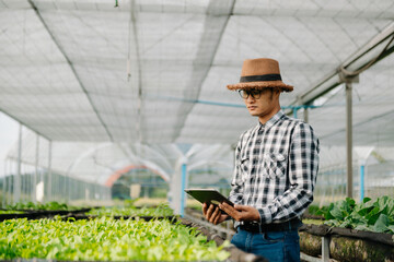 Obraz premium Agriculture technology farmer woman holding tablet or tablet technology to research about agriculture problems analysis data and visual icon.Smart farming .