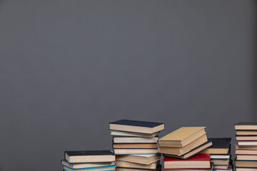 education science stack of books in the library on a gray background