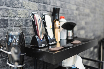 Set of barber machines and utensils on the barbershop shelves