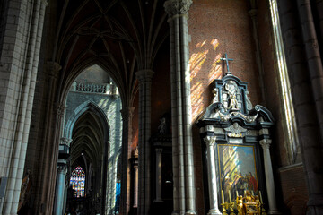 Obraz premium Sunlit Corridors of St. Bavo's Cathedral - Ghent, Belgium