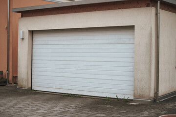Exterior view of a beautiful house with garage gate.