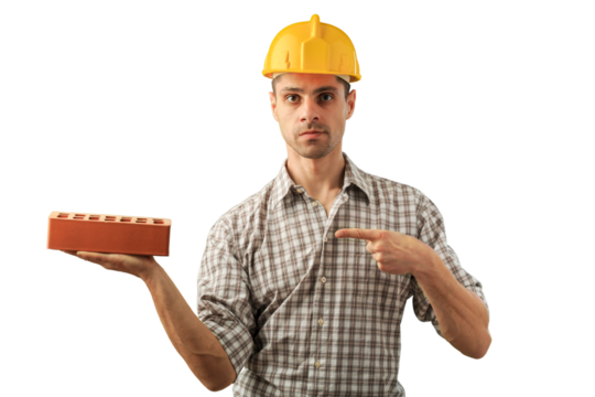Handsome man in worker helmet with brick
