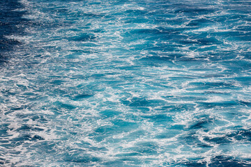 Obraz premium Blue sea background. Vessel ocean wake. Marine waves. Outdoor