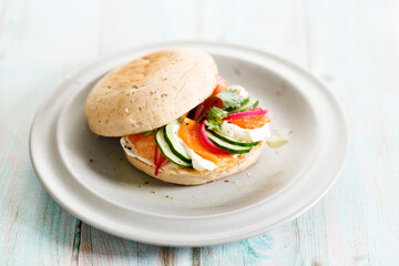 Smoked salmon sandwich with cucumber and cream cheese.