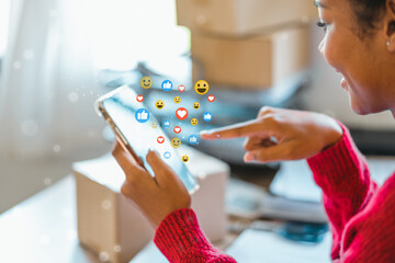 African American teenage woman using a smartphone with Icon communication network social media network pop notification  concept.