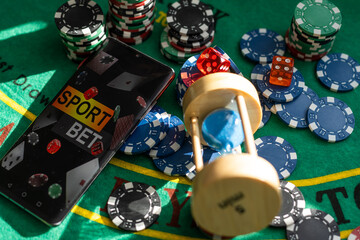 Poker Chips on a gaming table with dramatic lighting