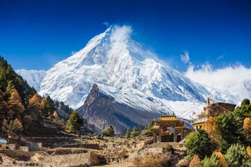 Himalaya scenic mountain landscape against the blue sky. Manaslu mountain