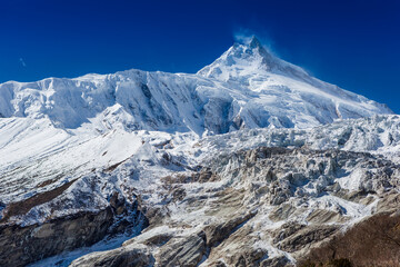 Fototapeta na wymiar Himalaya scenic mountain landscape against the blue sky. Manaslu mountain