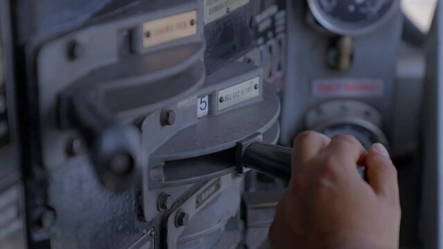 4K footage from driver control console of a locomotive. Engineer gearing throttle handle in compartment of moving train stock video. 