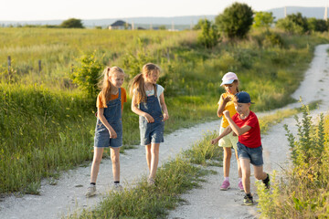 children on a walk in the summer