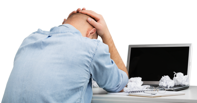 Businessman with stress working on office desk