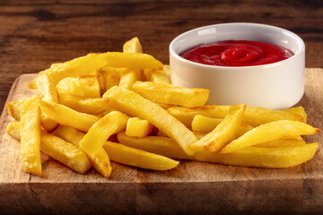 French fries, potato snack with ketchup, fast food on a wooden table, a side dish
