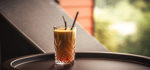 Orange cocktail at the table in the spa hotel